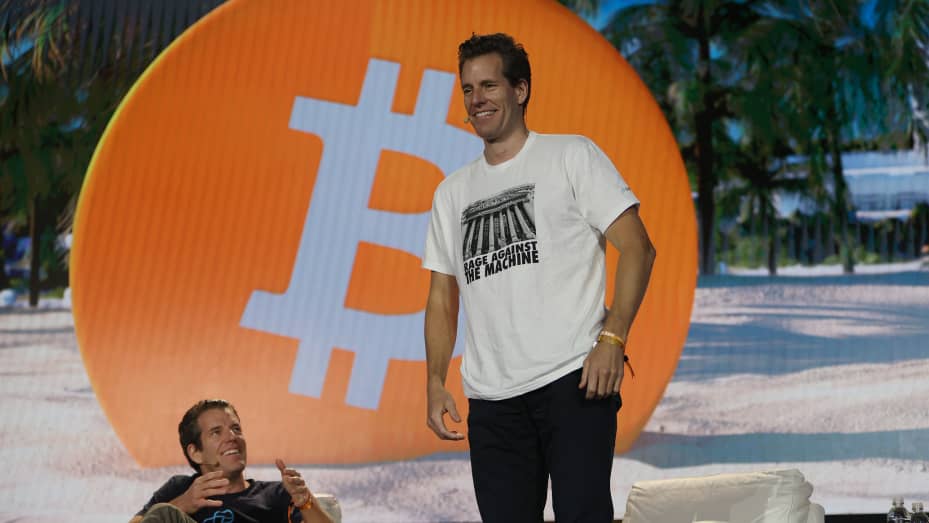 Tyler Winklevoss and Cameron Winklevoss (L-R), co-founders of crypto exchange Gemini, on stage at the Bitcoin 2021 Convention in Miami, Florida.